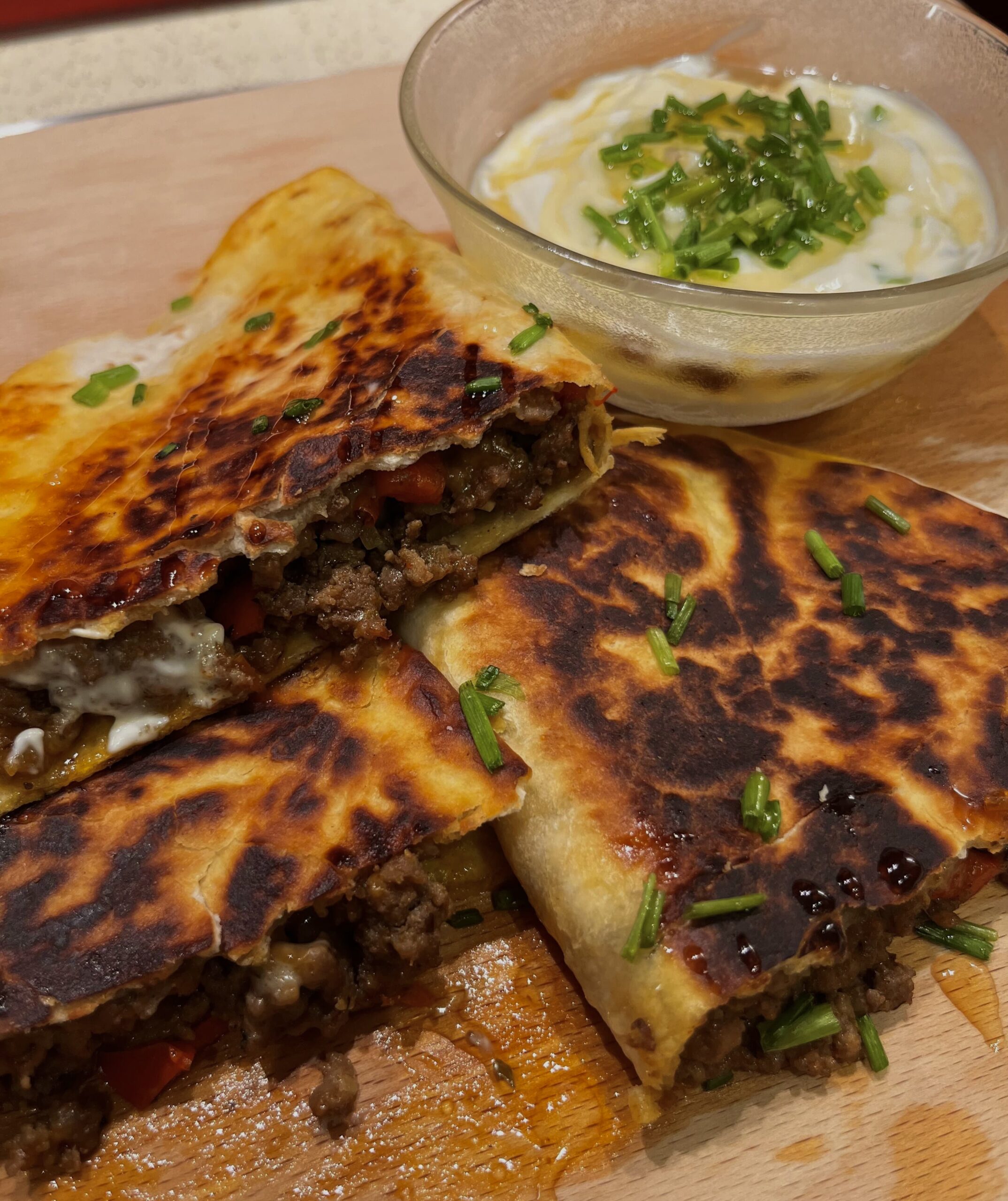 Triple cheese honey quesadillas with golden, crispy tortillas, melted cheddar, Red Leicester, and smoked cheddar, drizzled with sweet honey – a perfect balance of savoury and sweet.