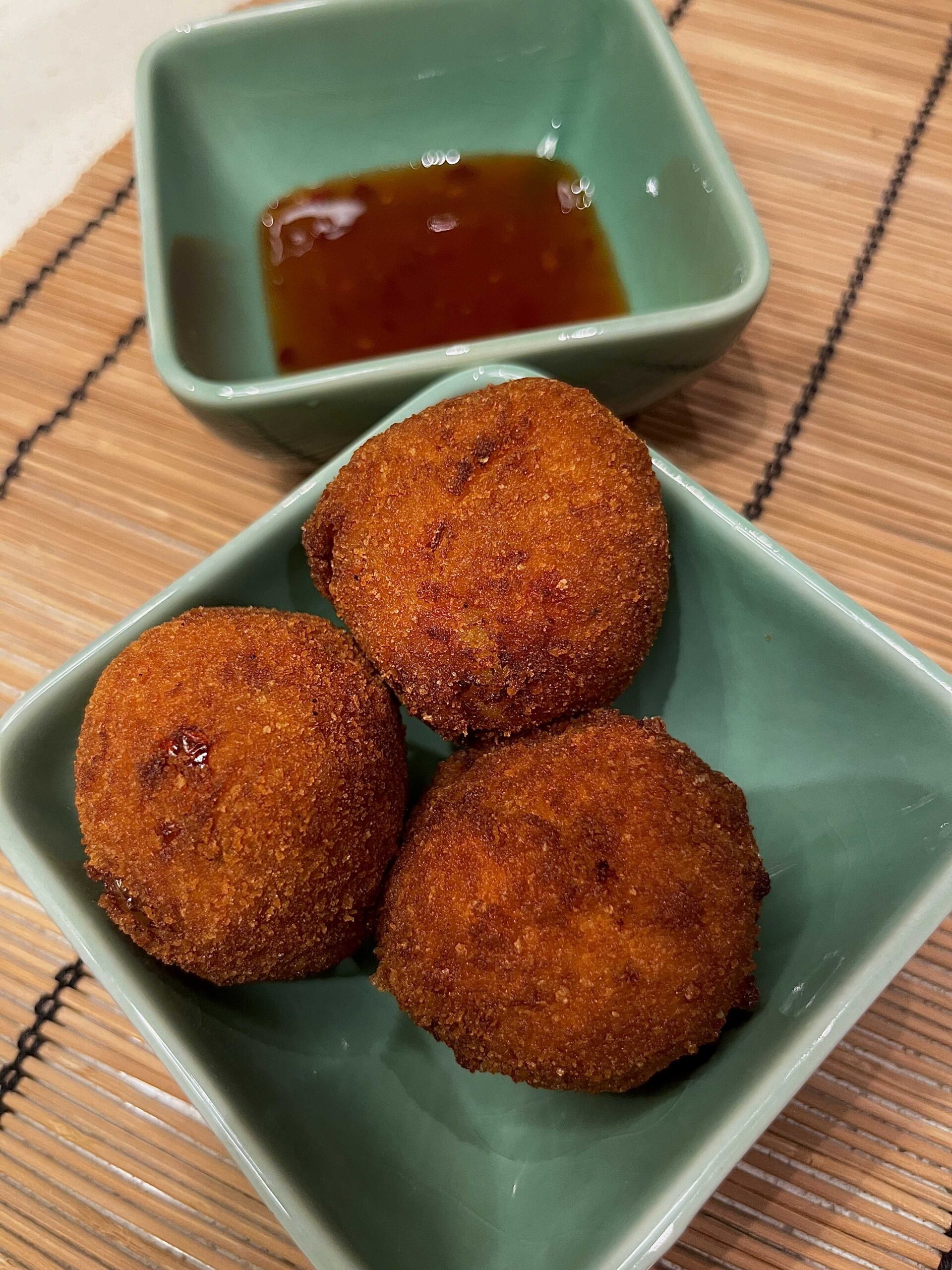 Crispy golden chorizo potato balls (Papas Rellenas) filled with spicy chorizo and creamy mashed potatoes, served with a sweet chilli dipping sauce.